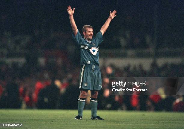 Alan Shearer of Newcastle United stands arms in the air celebrating towards the Sunderland fans after the FA Carling Premiership match between...