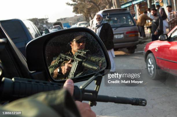 Private security contractor, Neil Gary a former U.S. Marine, rides in an SUV while providing security for a convoy in Kabul, Afghanistan on November...