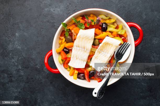 fillet of white cod fish on a dark - white chopping board stock pictures, royalty-free photos & images