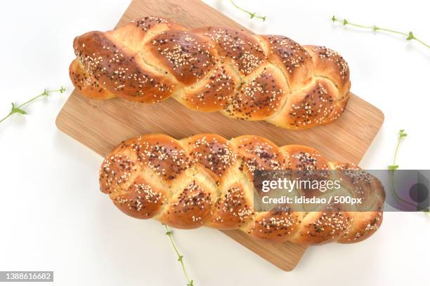 fresh homemade artisan bread,high angle view of bread on cutting board - challah stock pictures, royalty-free photos & images