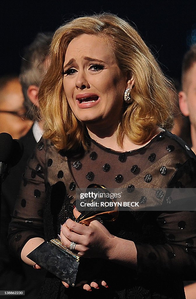 Singer Adele cries as she accepts her Gr