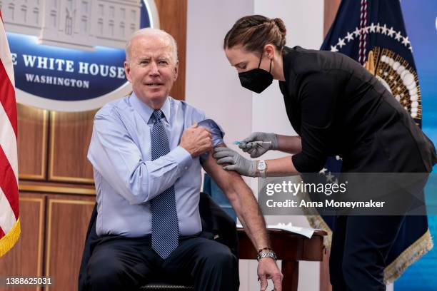 President Joe Biden receives a fourth dose of the Pfizer/BioNTech Covid-19 vaccine in the South Court Auditorium on March 30, 2022 in Washington, DC....