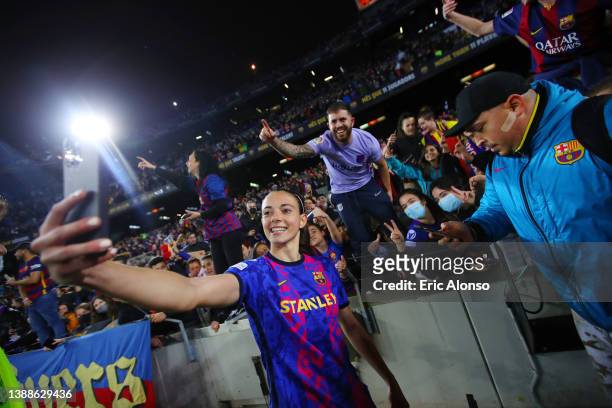 Aitana Bonmati of FC Barcelona takes a photo with fans following their victory in the UEFA Women's Champions League Quarter Final Second Leg match...