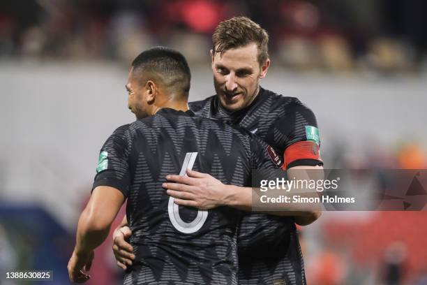 Chris Wood of New Zealand congratulates Bill Tuiloma on his second goal of the OFC World Cup qualifiers final at Grand Hamad Stadium on March 30,...