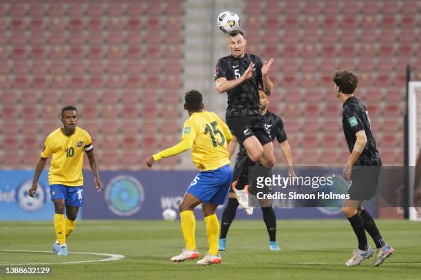 Tommy Smith of New Zealand wins a header during the 2022 FIFA World Cup Oceania Qualifier Final match between Solomon Islands and New Zealand at...