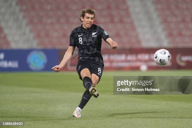 Joe Bell of New Zealand passes the ball during the OFC World Cup qualifiers final at Grand Hamad Stadium on March 30, 2022 in Doha, Qatar.