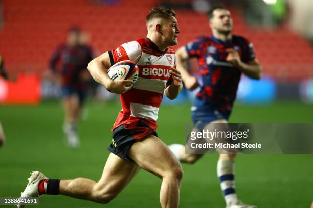 Alex Morgan of Gloucester breaks clear to score his sides fifth try during the Premiership Rugby Cup match between Bristol Bears and Gloucester Rugby...