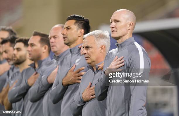 New Zealand manager, Danny Hay, sings the national anthem before the 2022 FIFA World Cup Oceania Qualifier Final match between Solomon Islands and...