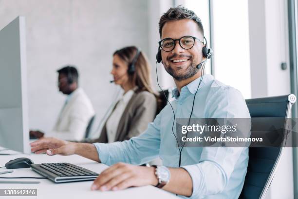 call center workers. - consultation at office desk imagens e fotografias de stock