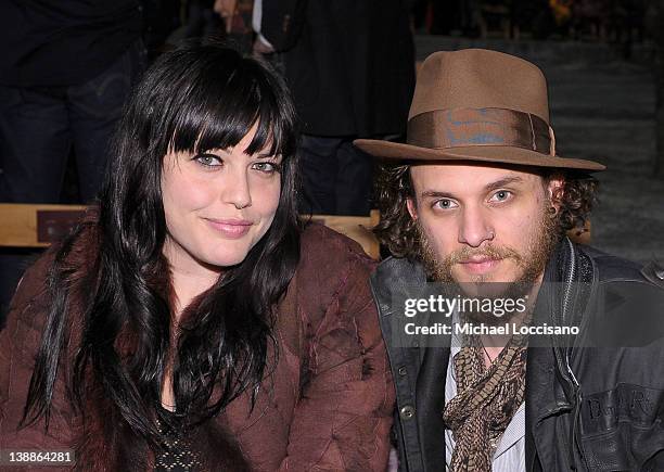 Mia Tyler and Jesse Kotansky attend the Tommy Hilfiger Fall 2012 fashion show during Mercedes-Benz Fashion Week at Park Avenue Armory on February 12,...