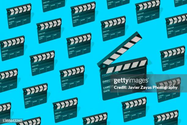 some clapper boards on blue background - television studio lights stock pictures, royalty-free photos & images