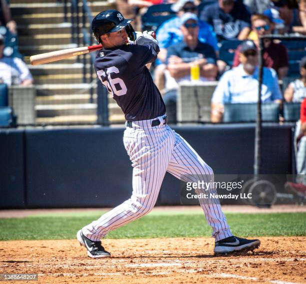 New York Yankees' Kyle Higashioka hits a single in the bottom of the 4th inning against the Philadelphia Phillies at George E. Steinbrenner Field in...