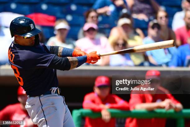 Javier Baez of the Detroit Tigers hits an RBI double in the third inning against the Philadelphia Phillies during a Grapefruit League spring training...