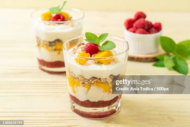 homemade mango and raspberry with yogurt and granola - blended drink ストックフォトと画像