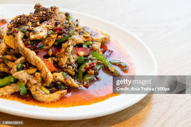 stir-fried pork with mala chilli,close-up of food in plate on table - szechuan cuisine stockfoto's en -beelden