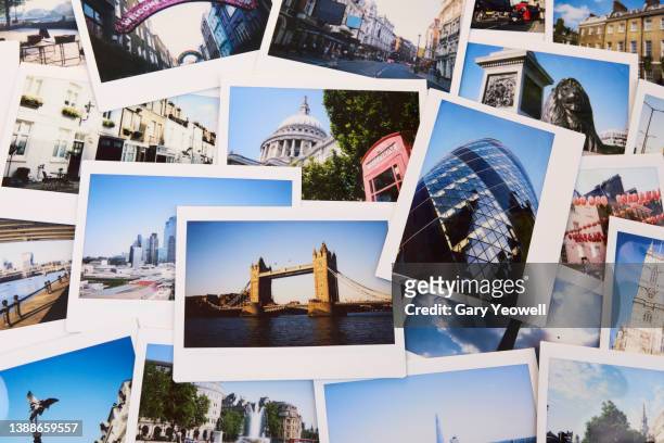 collection of instant travel holiday photos of london on a table - photos memories stock pictures, royalty-free photos & images