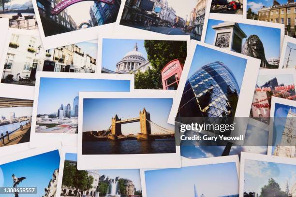 collection of instant travel holiday photos of london on a table - travel photos - fotografias e filmes do acervo