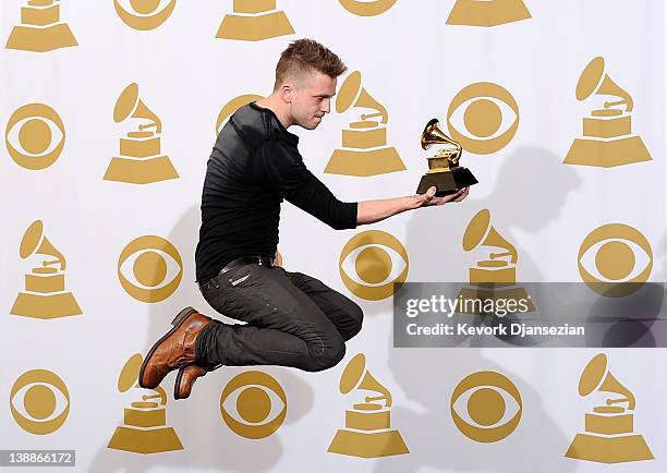 Producer/engineer Ryan Tedder, winner of the GRAMMY for Album of the Year for "21", poses in the press room at the 54th Annual GRAMMY Awards at...