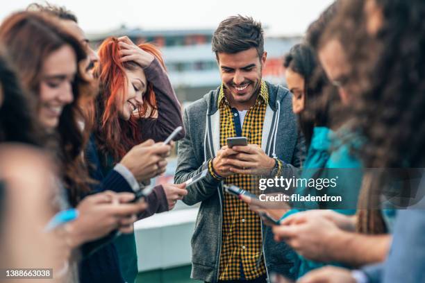 digital generation - smartphones dangling stock pictures, royalty-free photos & images