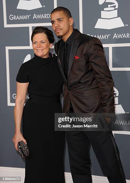 Rapper J Cole and guest arrive at the 54th Annual GRAMMY Awards held at Staples Center on February 12, 2012 in Los Angeles, California.