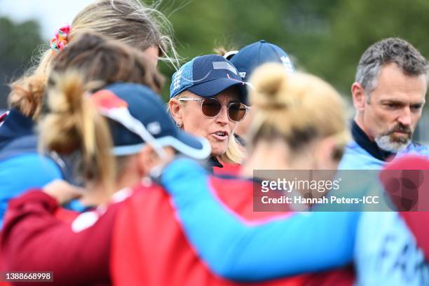 Lisa Keightley, head coach of England talks to her players ahead of the 2022 ICC Women's Cricket World Cup Semi Final match between South Africa and...