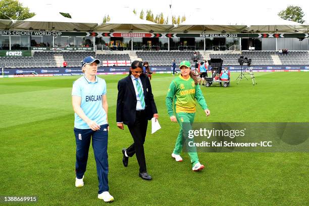 Match referee GS Lakshmi takes to the field with the team captains Heather Knight of England and Sune Luus of South Africa ahead of the 2022 ICC...