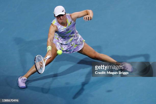 Iga Swiatek of Poland returns a shot to Petra Kvitova of the Czech Republic during the Women’s Singles match on Day 10 of the 2022 Miami Open...