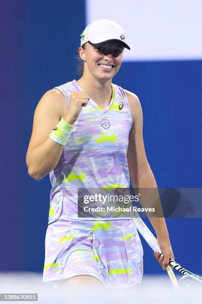 Iga Swiatek of Poland celebrates match point in her match against Petra Kvitova of the Czech Republic during the Miami Open at Hard Rock Stadium on...