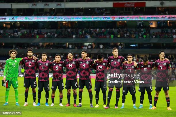 Players of Mexico line up during the national anthem ceremony prior the match between Mexico and El Salvador as part of the Concacaf 2022 FIFA World...