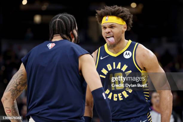 Justin Anderson of the Indiana Pacers celebrates with Duane Washington Jr. #4 in the third quarter against the Denver Nuggets at Gainbridge...