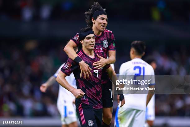 Raúl Jiménez of Mexico celebrates with teammate Érick Gutiérrez after scoring his team's second goal during the match between Mexico and El Salvador...