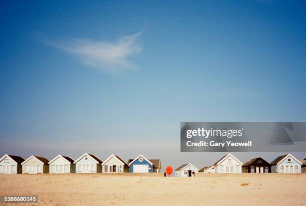 beach huts and blue sky - beach huts stock pictures, royalty-free photos & images