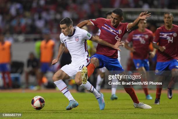 Gio Reyna of the United States is marked by Daniel Chacon of Costa Rica during a FIFA World Cup qualifier game between Costa Rica and USMNT at...