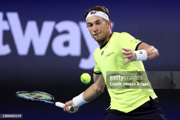 Casper Ruud of Norway returns a shot to Alexander Zverev of Germany during the Men's Singles match on Day 10 of the 2022 Miami Open presented by Itaú...