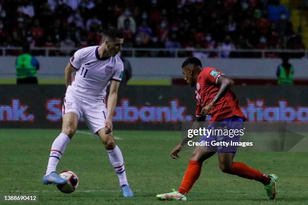 Giovanni Reyna of United States fights for the ball with José Ortíz of Costa Rica during a match between Costa Rica and United States as part of the...