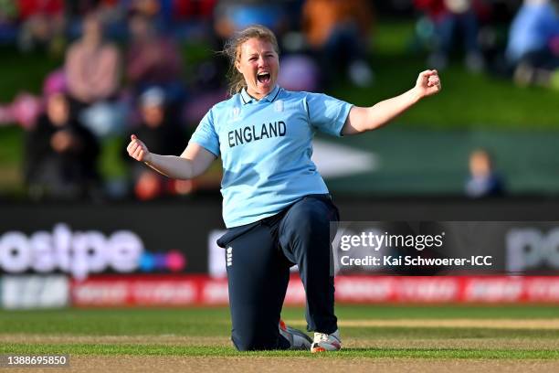Anya Shrubsole of England celebrates catching out Laura Wolvaard of South Africa from her own bowling during the 2022 ICC Women's Cricket World Cup...
