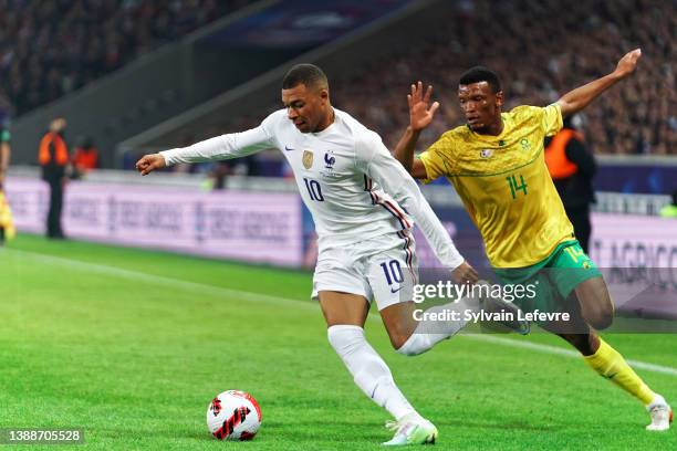 Mothobi Mvala of South Africa competes for the ball with Kylian Mbappe of France during the International friendly match between France and South...