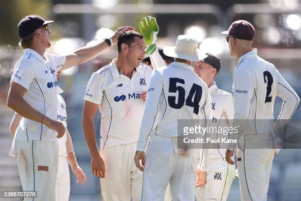 Scott Boland of Victoria celebrates the wicket of Sam Whiteman of Western Australia during day one of the Sheffield Shield Final match between...