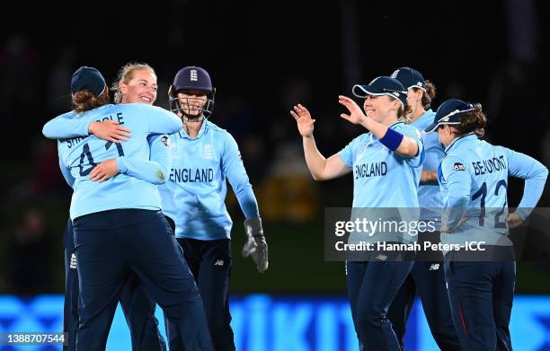 Sophie Ecclestone of England celebrates with teammates after dismissing Marizanne Kapp of South Africa during the 2022 ICC Women's Cricket World Cup...