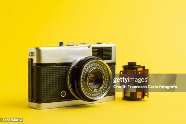 vintage film camera and photo film - highlight reel stock pictures, royalty-free photos & images