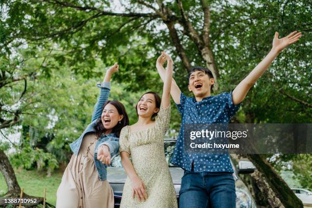 three friends on a road trip and having fun - asia friend stock pictures, royalty-free photos & images