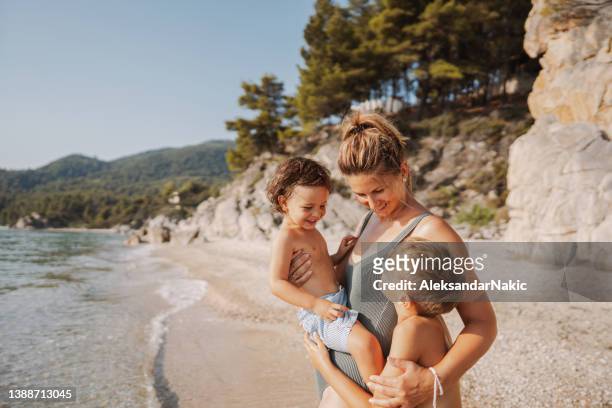 moment for my boys - family on beach stockfoto's en -beelden