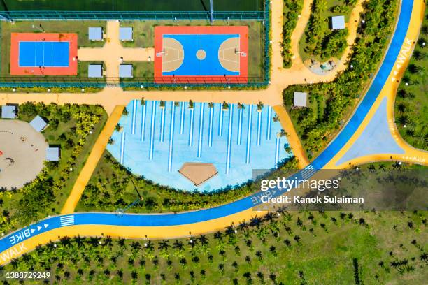 aerial view of playground  and basket ball court in public park - basketball court texture stock pictures, royalty-free photos & images