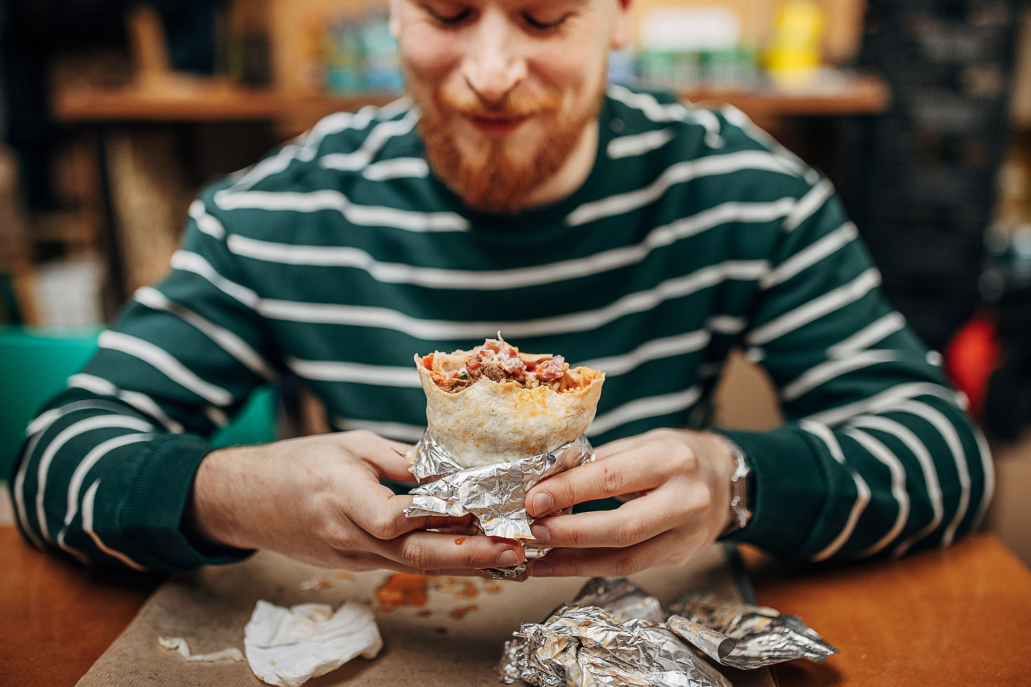 Man eating burritos Man eating burritos