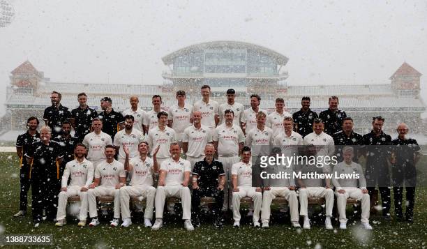 Nottinghamshire CCC pose for a team photo, as snow falls during the Nottinghamshire CCC Photocall at Trent Bridge on March 31, 2022 in Nottingham,...