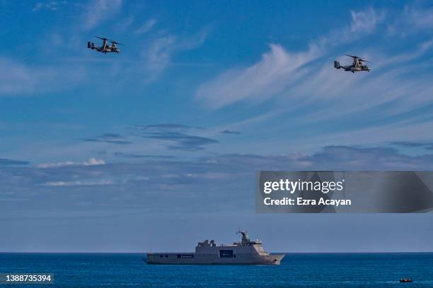 Marine OV-22 Osprey aircrafts fly toward a beach as US and Philippine marines take part in a joint amphibious assault exercise as part of the annual...