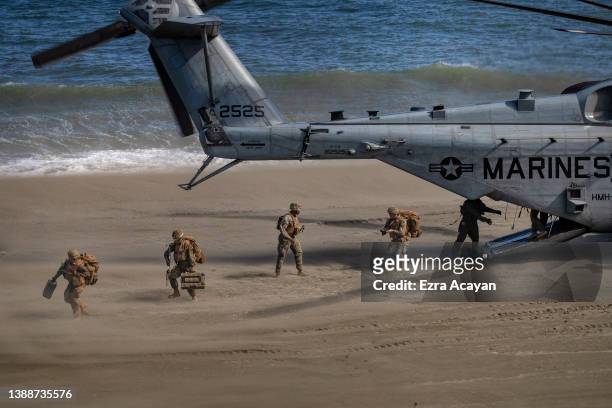 Marine CH53 helicopter unloads US marines as they take part in a joint amphibious assault exercise as part of the annual 'Balikatan' US-Philippines...
