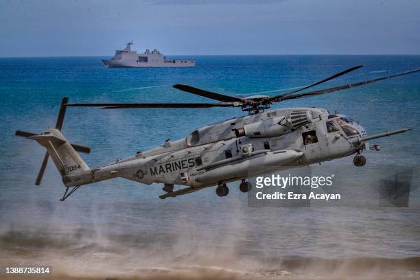 Marine CH53 helicopter takes off as US and Philippine marines take part in a joint amphibious assault exercise as part of the annual 'Balikatan'...