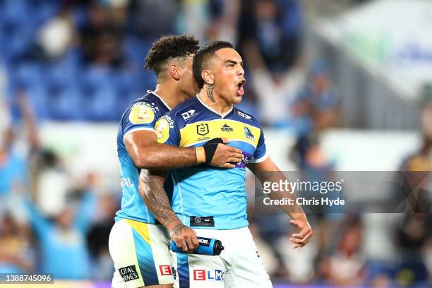 Erin Clark of the Titans celebrates a try during the round four NRL match between the Gold Coast Titans and the Wests Tigers at Cbus Super Stadium,...