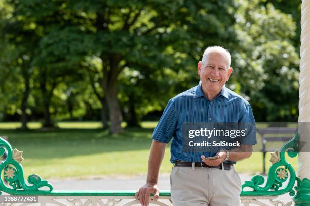 carefree in the park - senior copy space stock pictures, royalty-free photos & images